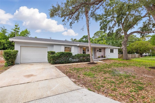1470 Serpentine Dr S, Saint Petersburg, FL 33705 - single story home featuring a garage, concrete driveway, and stucco siding
