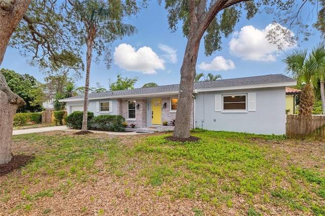 1470 Serpentine Dr S, Saint Petersburg, FL 33705 - ranch-style home with a garage, concrete driveway, and stucco siding