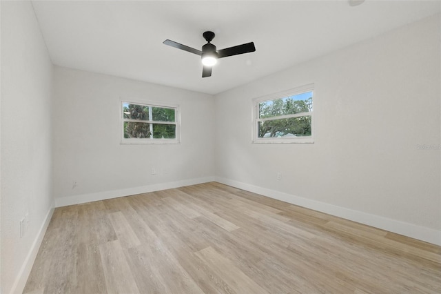 1470 Serpentine Dr S, Saint Petersburg, FL 33705 - empty room with light wood finished floors, baseboards, and a ceiling fan