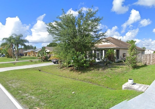 1720 SW Cameo Blvd, Port St Lucie, FL 34953 - obstructed view of property featuring driveway