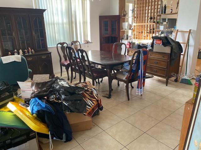 1720 SW Cameo Blvd, Port St Lucie, FL 34953 - dining space featuring light tile patterned floors
