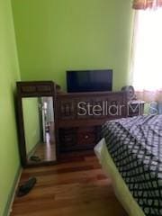 1720 SW Cameo Blvd, Port St Lucie, FL 34953 - bedroom featuring wood finished floors