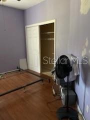 1720 SW Cameo Blvd, Port St Lucie, FL 34953 - bedroom featuring wood finished floors