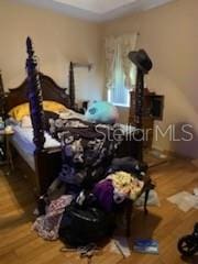 1720 SW Cameo Blvd, Port St Lucie, FL 34953 - bedroom featuring wood finished floors