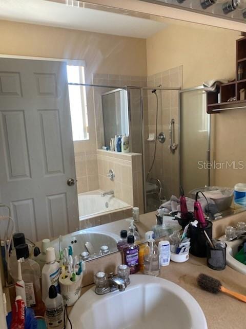 1720 SW Cameo Blvd, Port St Lucie, FL 34953 - full bathroom featuring a stall shower, a garden tub, and vanity