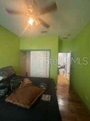 1720 SW Cameo Blvd, Port St Lucie, FL 34953 - bedroom with lofted ceiling and a ceiling fan