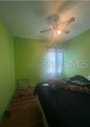 1720 SW Cameo Blvd, Port St Lucie, FL 34953 - bedroom featuring a ceiling fan and baseboards