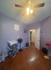 1720 SW Cameo Blvd, Port St Lucie, FL 34953 - bedroom with wood finished floors and ceiling fan