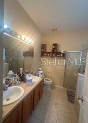 1720 SW Cameo Blvd, Port St Lucie, FL 34953 - bathroom featuring a stall shower, tile patterned floors, and vanity