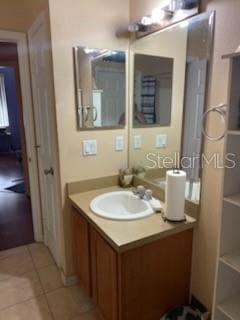 1720 SW Cameo Blvd, Port St Lucie, FL 34953 - bathroom with vanity and tile patterned floors