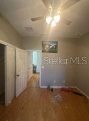 1720 SW Cameo Blvd, Port St Lucie, FL 34953 - unfurnished bedroom with wood finished floors and ceiling fan