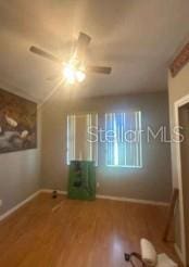 1720 SW Cameo Blvd, Port St Lucie, FL 34953 - unfurnished bedroom with wood finished floors and ceiling fan