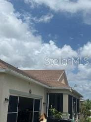 1720 SW Cameo Blvd, Port St Lucie, FL 34953 - view of property exterior featuring an attached garage