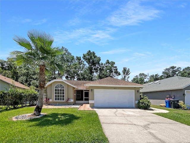 8812 Bayaud Dr, Tampa, FL 33626 - ranch-style house with stucco siding, driveway, a garage, and a front yard
