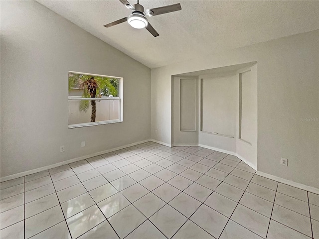 8812 Bayaud Dr, Tampa, FL 33626 - unfurnished bedroom featuring a textured ceiling, light tile patterned flooring, vaulted ceiling, a ceiling fan, and baseboards