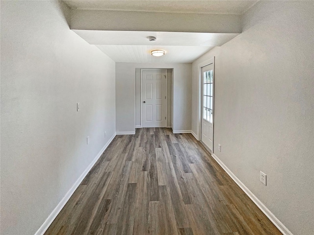 8812 Bayaud Dr, Tampa, FL 33626 - empty room with dark wood finished floors, baseboards, and a smoke detector