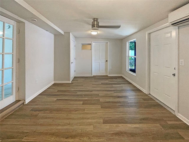 8812 Bayaud Dr, Tampa, FL 33626 - entryway featuring a wall mounted air conditioner, baseboards, and wood finished floors