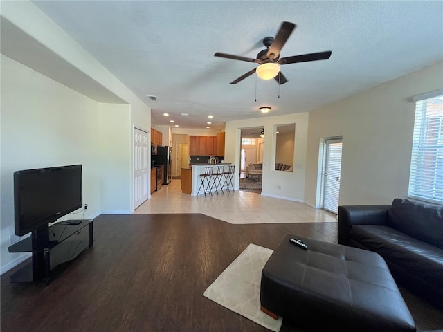 11420 Bridge Pine Dr, Riverview, FL 33569 - living area with light wood-style flooring, baseboards, ceiling fan, and recessed lighting