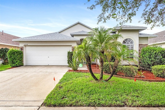 12746 Standbridge Dr, Riverview, FL 33579 - ranch-style house with an attached garage, driveway, and stucco siding