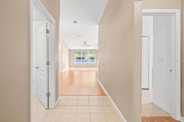 12746 Standbridge Dr, Riverview, FL 33579 - corridor featuring light tile patterned flooring and baseboards