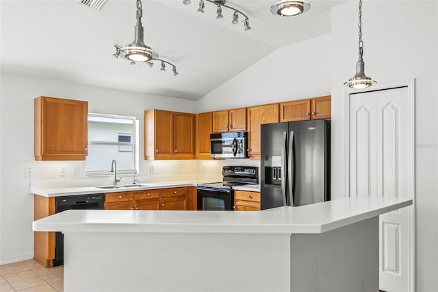 12746 Standbridge Dr, Riverview, FL 33579 - kitchen with black appliances, a sink, light countertops, vaulted ceiling, and pendant lighting