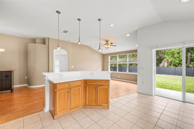 12746 Standbridge Dr, Riverview, FL 33579 - kitchen with vaulted ceiling, light countertops, ceiling fan, light tile patterned floors, and open floor plan