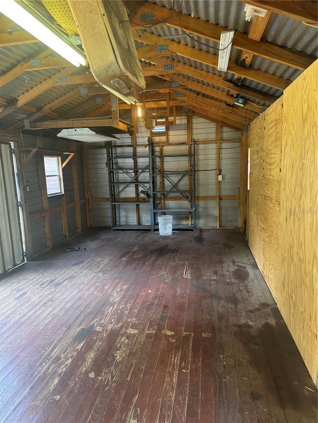 2220 Woods Trl, Lakeland, FL 33809 - misc room with hardwood / wood-style floors, wood walls, and a garage
