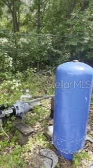 2220 Woods Trl, Lakeland, FL 33809 - exterior view of a water pressure tank