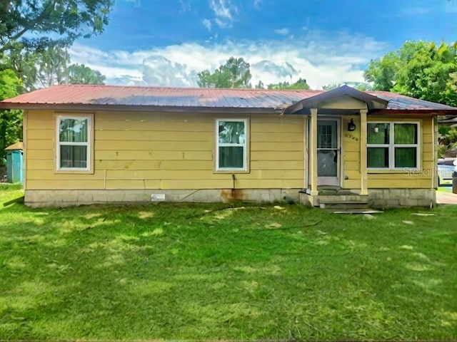 2220 Woods Trl, Lakeland, FL 33809 - view of front of home with a front lawn and metal roof