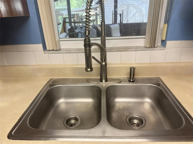 2220 Woods Trl, Lakeland, FL 33809 - kitchen view of a sink, decorative backsplash, and light countertops