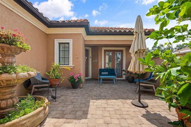 12672 Fontana Loop, Bradenton, FL 34211 - entrance to property with stucco siding and a patio