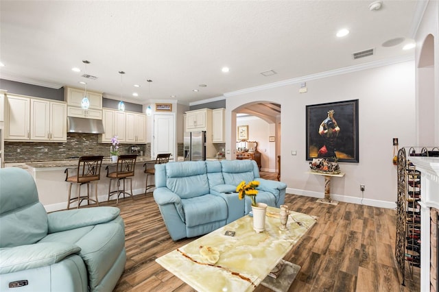 12672 Fontana Loop, Bradenton, FL 34211 - living area featuring arched walkways, recessed lighting, crown molding, wood finished floors, and baseboards