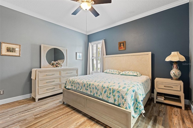 12672 Fontana Loop, Bradenton, FL 34211 - bedroom with crown molding, light wood-type flooring, baseboards, and a ceiling fan