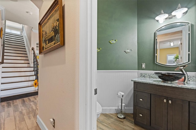 12672 Fontana Loop, Bradenton, FL 34211 - bathroom featuring vanity, wainscoting, wood finished floors, toilet, and baseboards