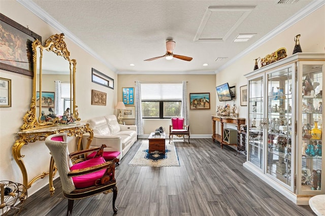 12672 Fontana Loop, Bradenton, FL 34211 - living room featuring wood finished floors, attic access, ornamental molding, baseboards, and a textured ceiling