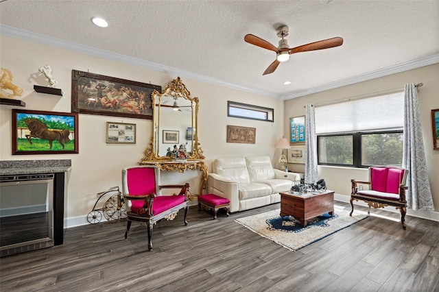 12672 Fontana Loop, Bradenton, FL 34211 - living room with wine cooler, wood finished floors, a ceiling fan, ornamental molding, and a textured ceiling