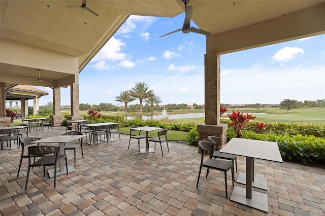 12672 Fontana Loop, Bradenton, FL 34211 - view of patio / terrace featuring a water view, outdoor dining space, and view of golf course