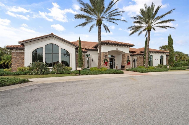 12672 Fontana Loop, Bradenton, FL 34211 - mediterranean / spanish-style house with stone siding, stucco siding, and a tiled roof