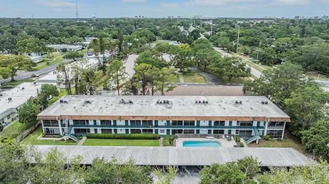 1485 Lakeview Rd Unit 19, Clearwater, FL 33756 - aerial view of property and surrounding area with a pool area and a tree filled landscape