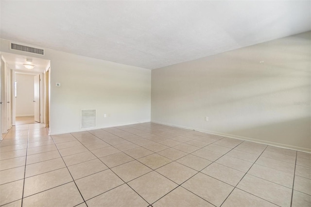 1485 Lakeview Rd Unit 19, Clearwater, FL 33756 - spare room featuring light tile patterned floors and baseboards