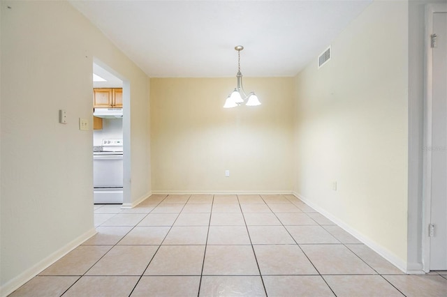 1485 Lakeview Rd Unit 19, Clearwater, FL 33756 - unfurnished dining area with a chandelier, light tile patterned floors, and baseboards