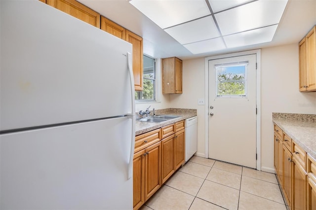 1485 Lakeview Rd Unit 19, Clearwater, FL 33756 - kitchen featuring white appliances, a sink, light countertops, light tile patterned floors, and baseboards