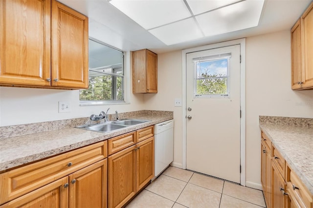 1485 Lakeview Rd Unit 19, Clearwater, FL 33756 - kitchen with white dishwasher, a sink, light tile patterned flooring, and light countertops