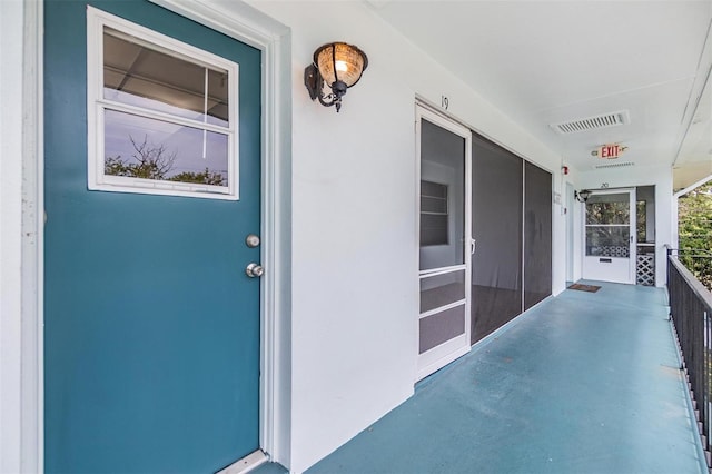 1485 Lakeview Rd Unit 19, Clearwater, FL 33756 - doorway to property featuring a porch and stucco siding