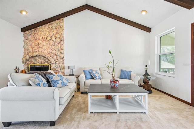 11285 8th St E, Treasure Island, FL 33706 - living area featuring light carpet, a stone fireplace, and baseboards