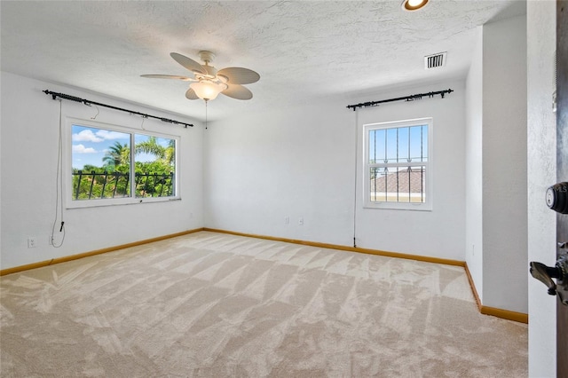 11285 8th St E, Treasure Island, FL 33706 - spare room with plenty of natural light, carpet floors, baseboards, and ceiling fan