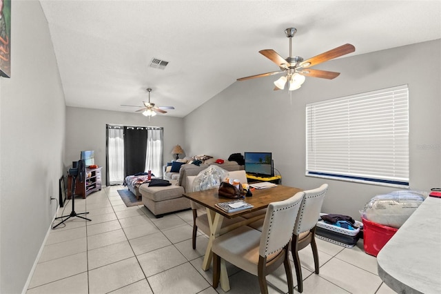 7124 Barclay Ave Unit A, Spring Hill, FL 34609 - living room with ceiling fan, light tile patterned floors, lofted ceiling, and baseboards