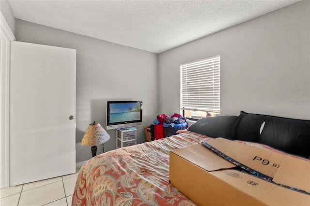 7124 Barclay Ave Unit A, Spring Hill, FL 34609 - tiled bedroom with a textured ceiling