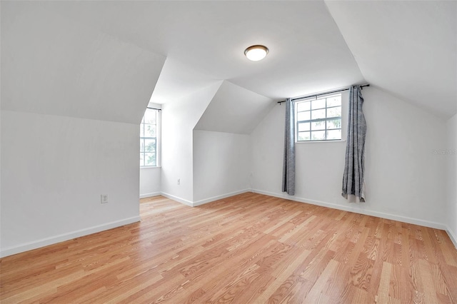 3865 Gatewood Dr, Sarasota, FL 34232 - additional living space featuring light wood-style flooring, plenty of natural light, lofted ceiling, and baseboards