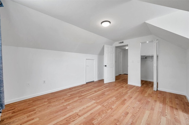 3865 Gatewood Dr, Sarasota, FL 34232 - additional living space with light wood-type flooring, vaulted ceiling, and baseboards